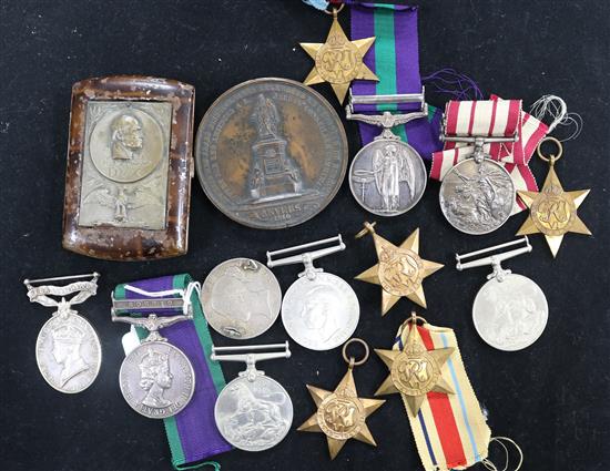 A group of medals and coins.